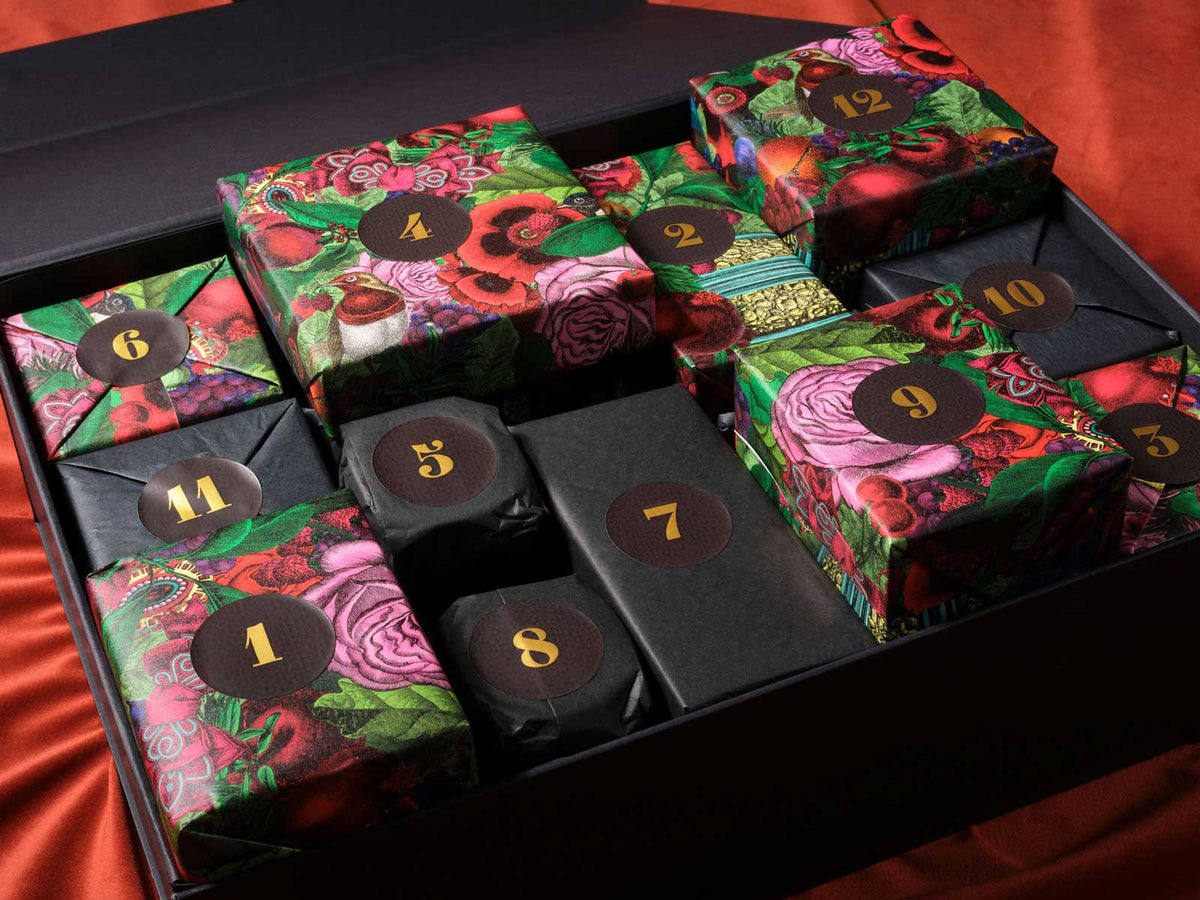 Twelve wrapped and numbered parcels inside the keepsake box